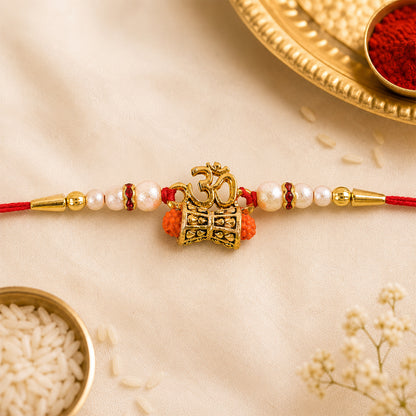 Elegant Golden Charm Rakhi for brother, showcasing its detailed golden charm and beadwork.