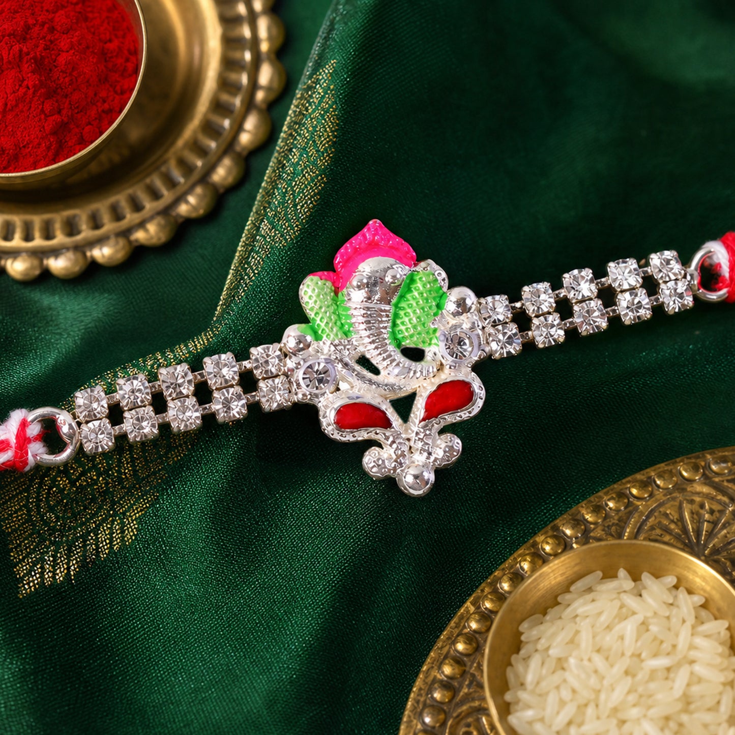 Silver-Toned Lord Ganesha Rakhi with Pink-Green Enamel, Double Crystal Chain & Red-White Thread