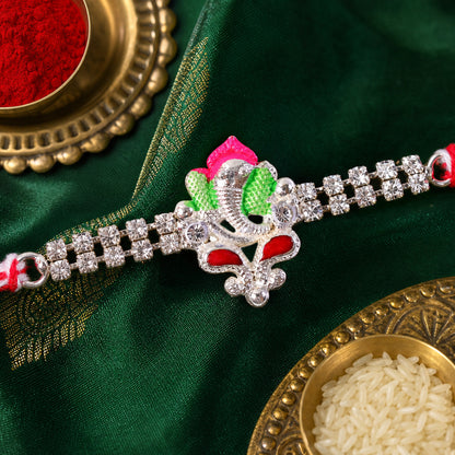 Silver-Toned Lord Ganesha Rakhi with Pink-Green Enamel, Double Crystal Chain & Red-White Thread