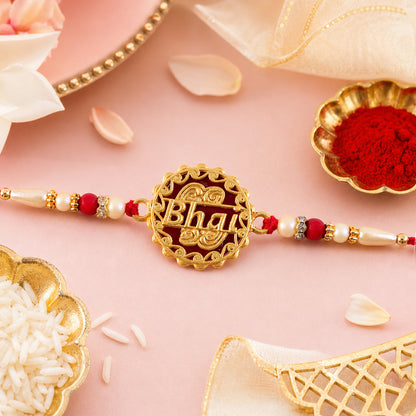 Swastik Rakhi – Golden Design with Red Beads & Thread