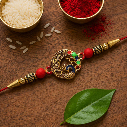 Peacock design rakhi displayed on a festive background.