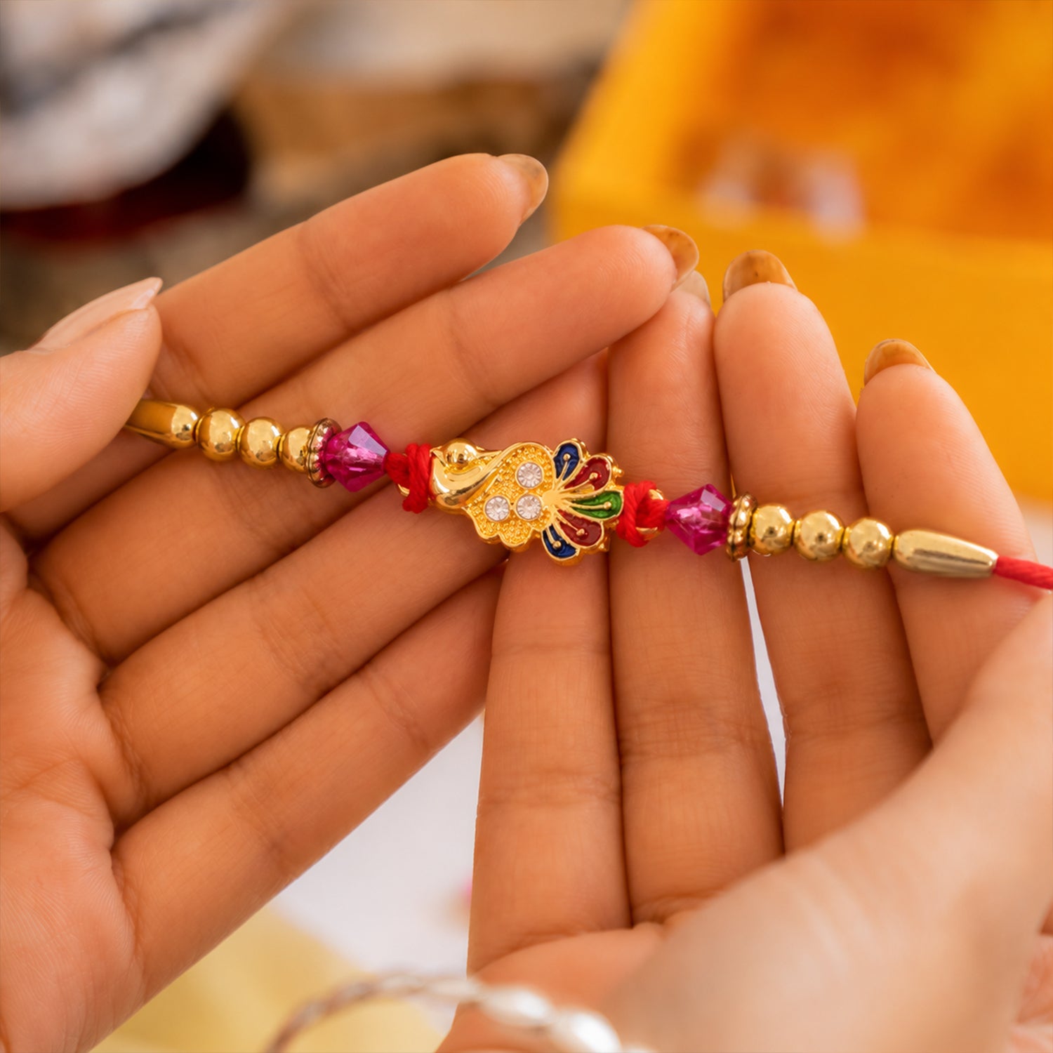 Golden Peacock Charm Rakhi for Brother