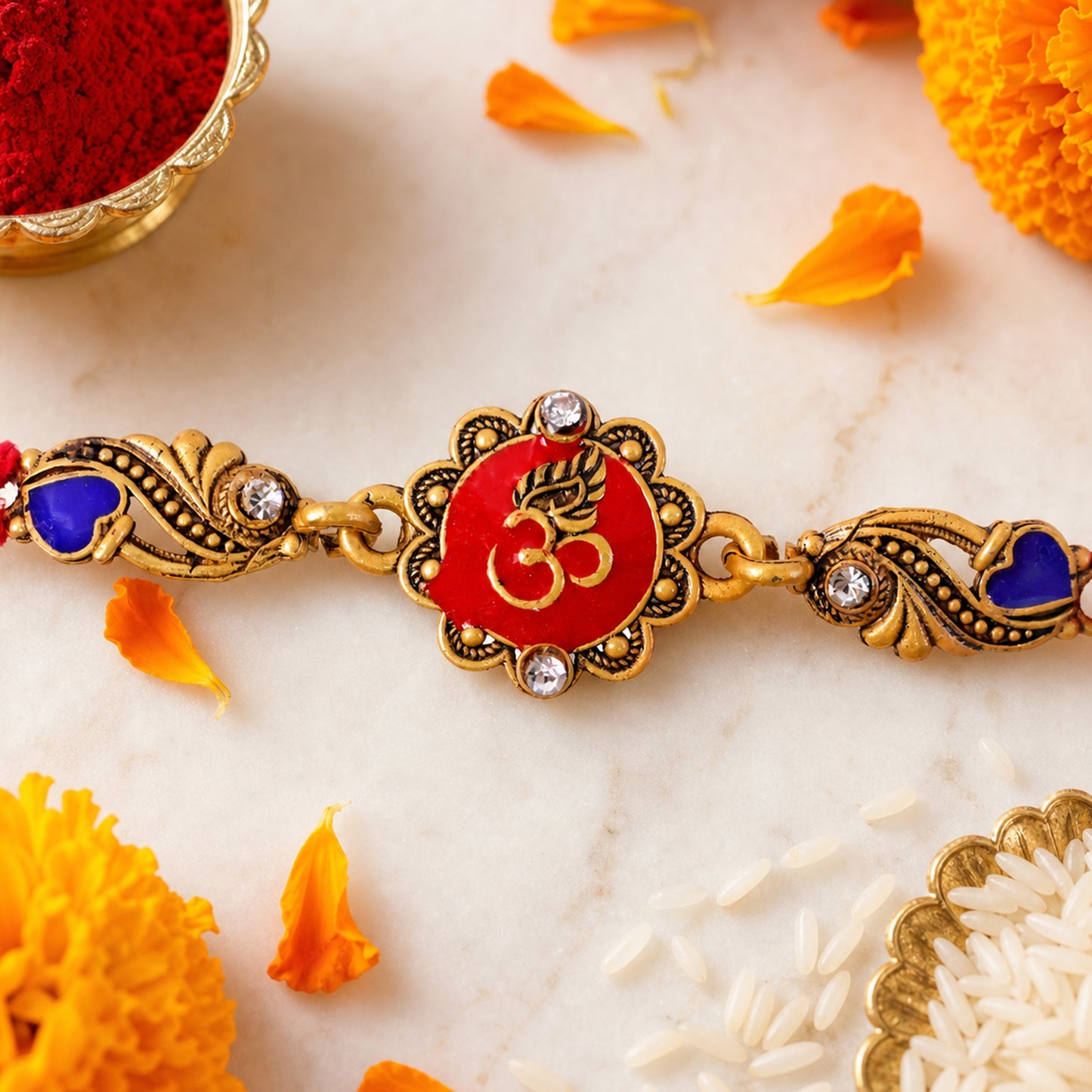 Traditional Rakhi showcasing Om Medallion, red stone accents and chain look for Gift
