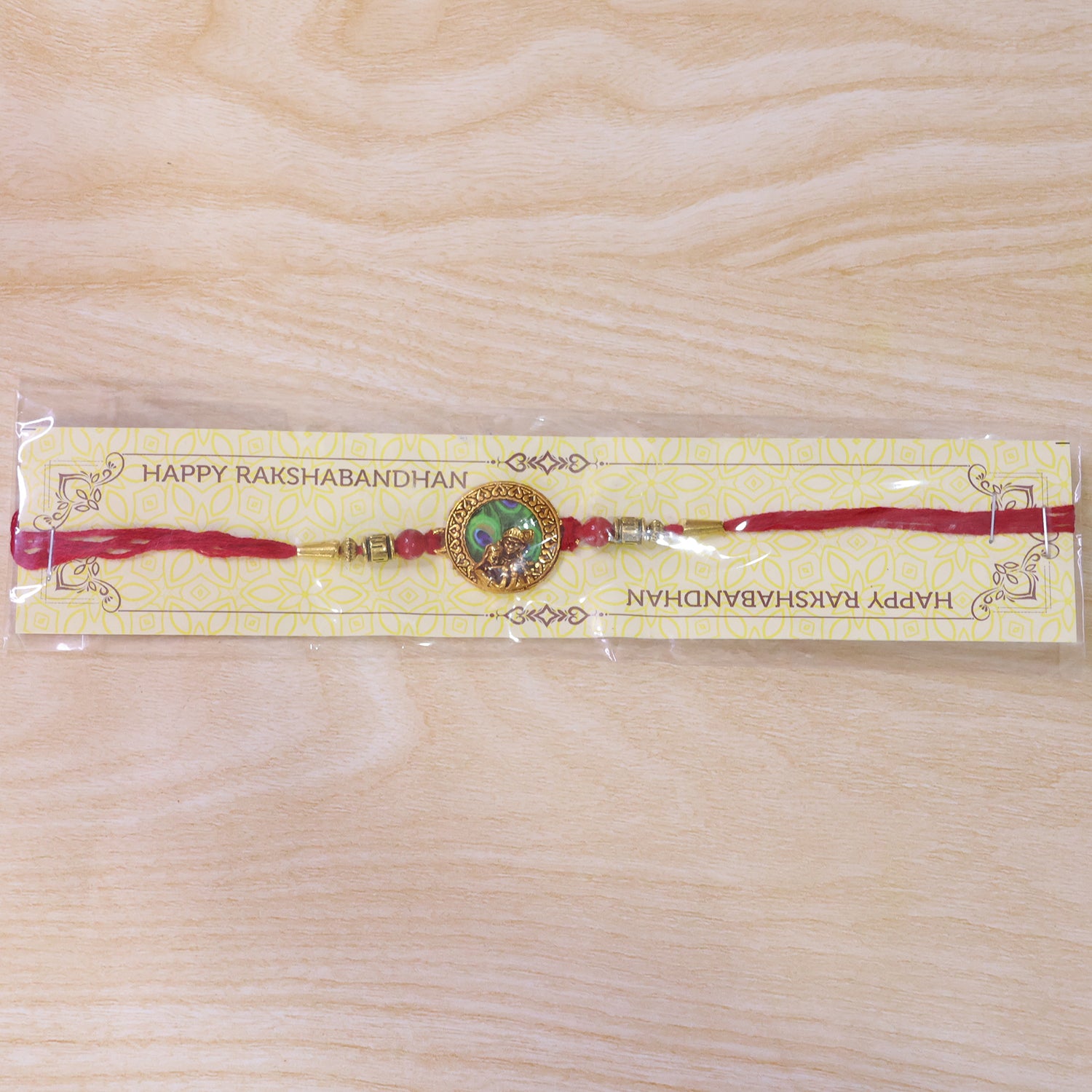 Krishna Rakhi – Traditional Peacock Feather Design with Beads