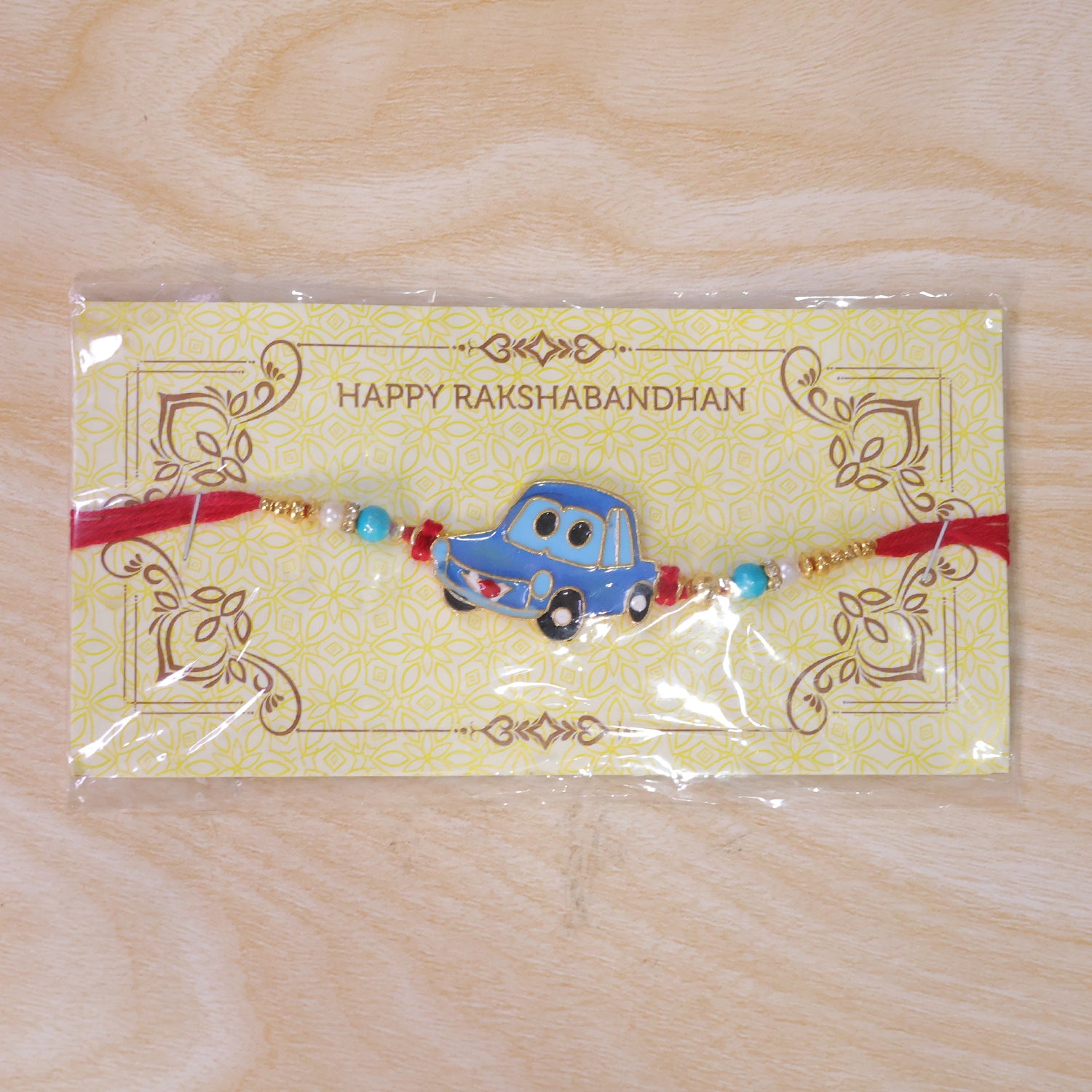 Kids Car Rakhi – Playful Design with Red Thread for Brothers