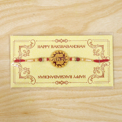 Swastik Rakhi – Golden Design with Red Beads & Thread