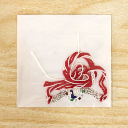 Classic Rakhi showcasing Paisley Swirl Charm, crystal sparkle and gift style for Gift