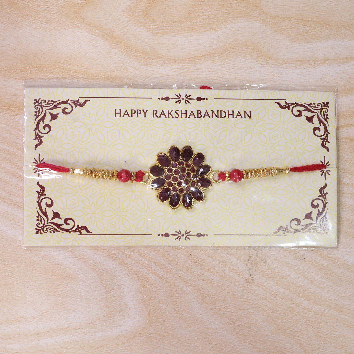 Red Floral Stone Rakhi – Elegant Bead Accents for Raksha Bandhan