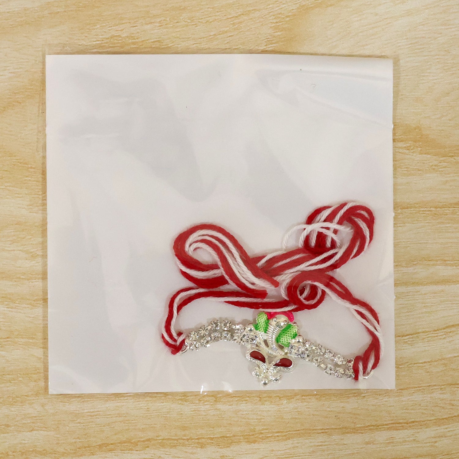 Silver-Toned Lord Ganesha Rakhi with Pink-Green Enamel, Double Crystal Chain & Red-White Thread