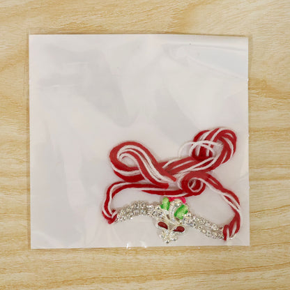 Silver-Toned Lord Ganesha Rakhi with Pink-Green Enamel, Double Crystal Chain & Red-White Thread
