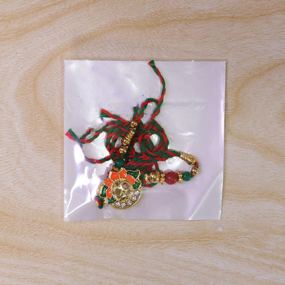 Lotus Om Pendant Rakhi with Orange Petals and Kundan Stones