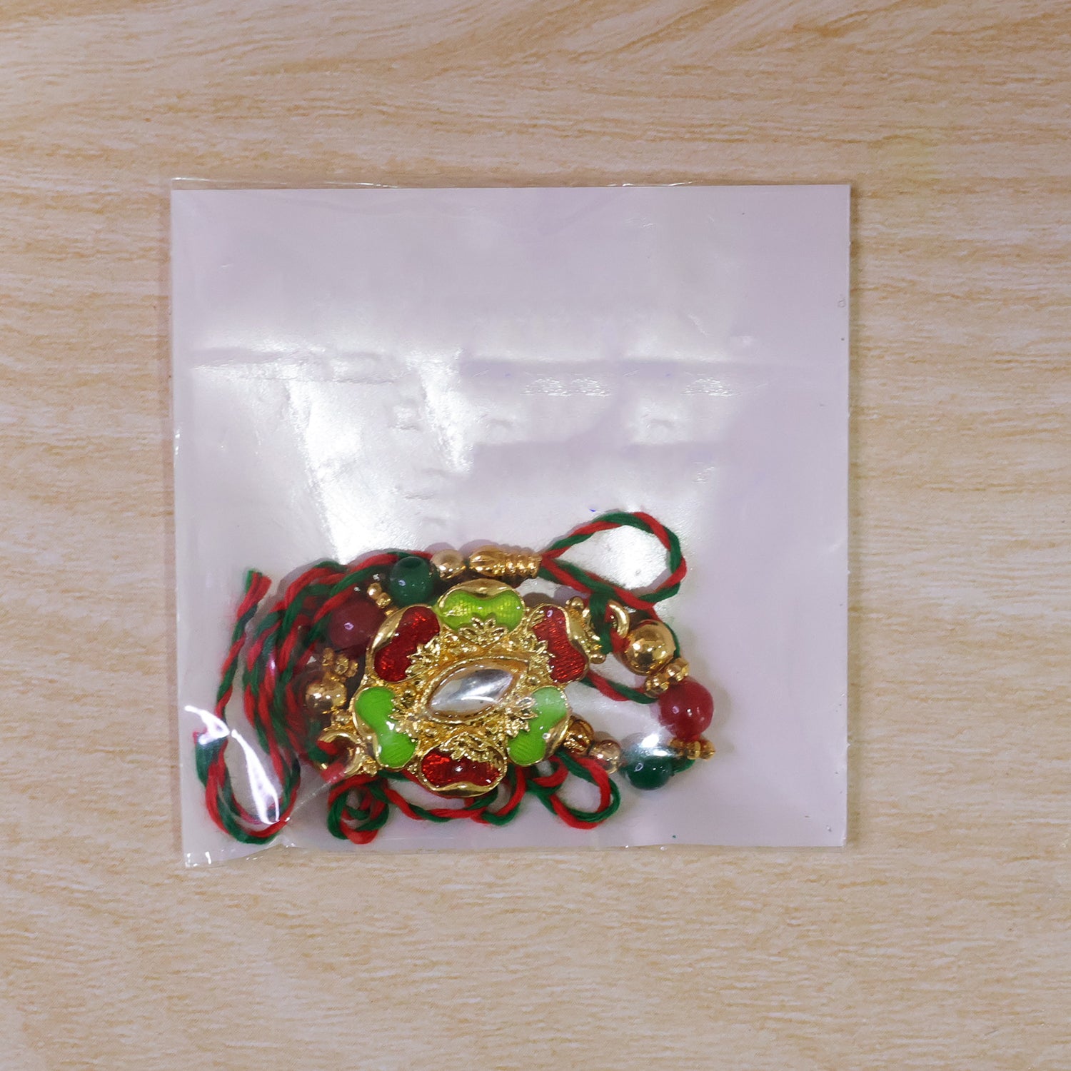 Green and Red Floral Kundan Mirror Pendant Rakhi with Multicolor Beads