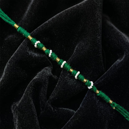 Close-up of green pearl beaded rakhi design