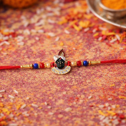 Elegant Krishna themed Rakhi with beads