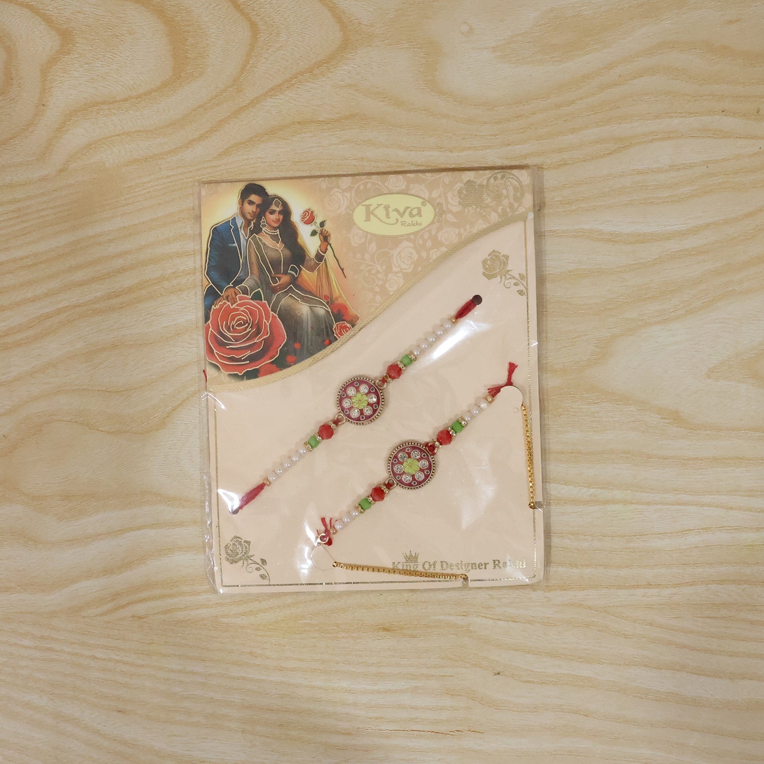 Live display of designer pearl Rakhi with floral stones