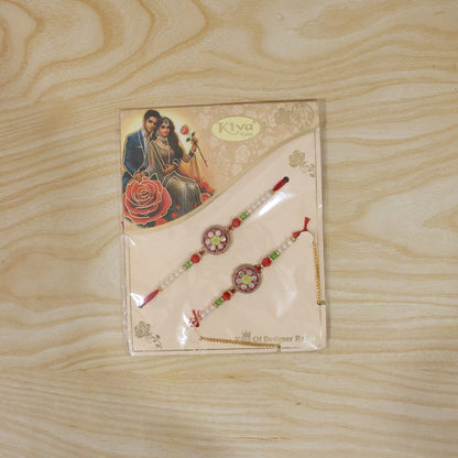 Live display of designer pearl Rakhi with floral stones