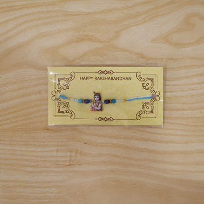 Live shot of Lord Krishna Designer Rakhi with blue beads