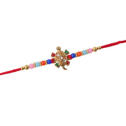 Cute Turtle Design Rakhi laid out flat on surface