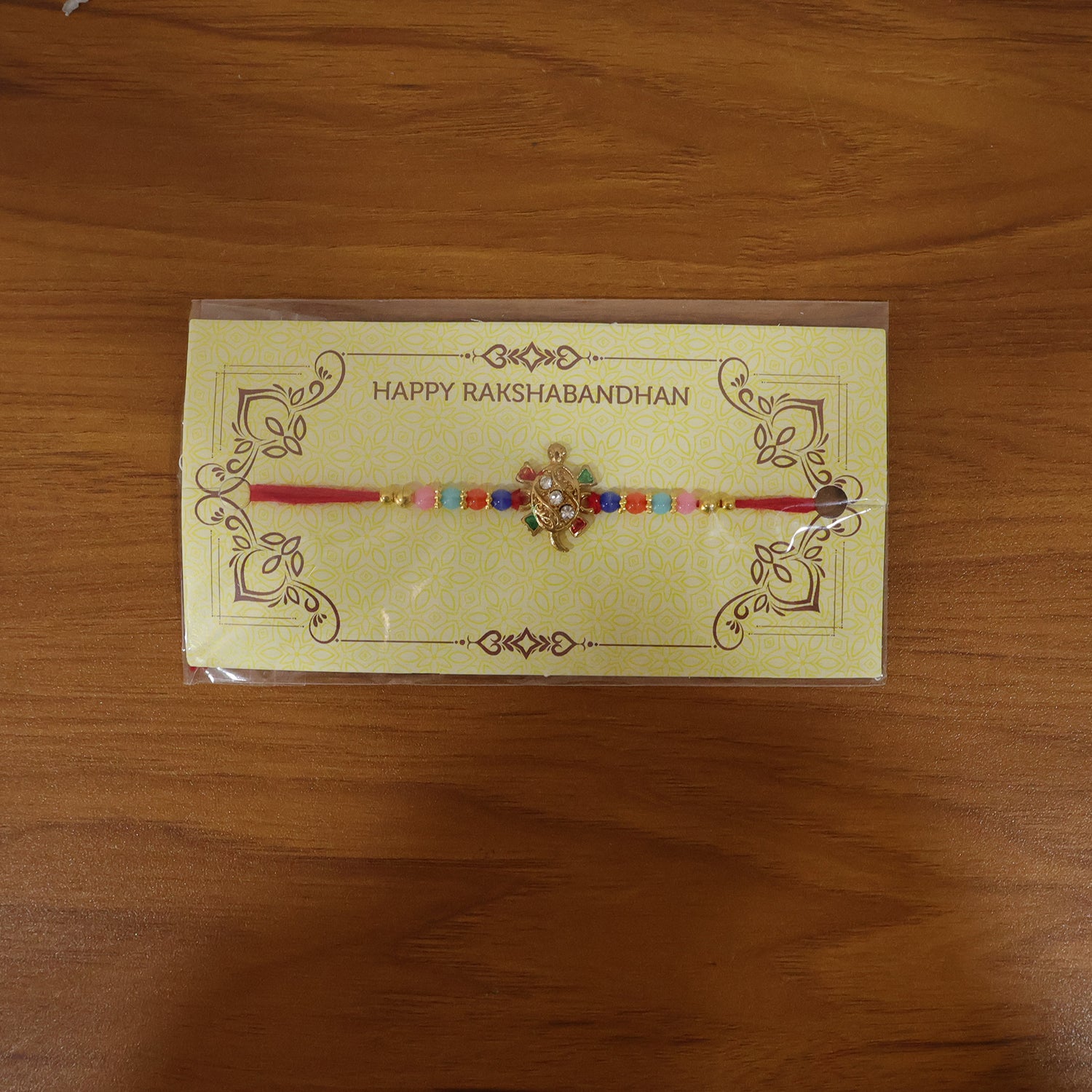 Live display image of Cute Turtle Design Rakhi