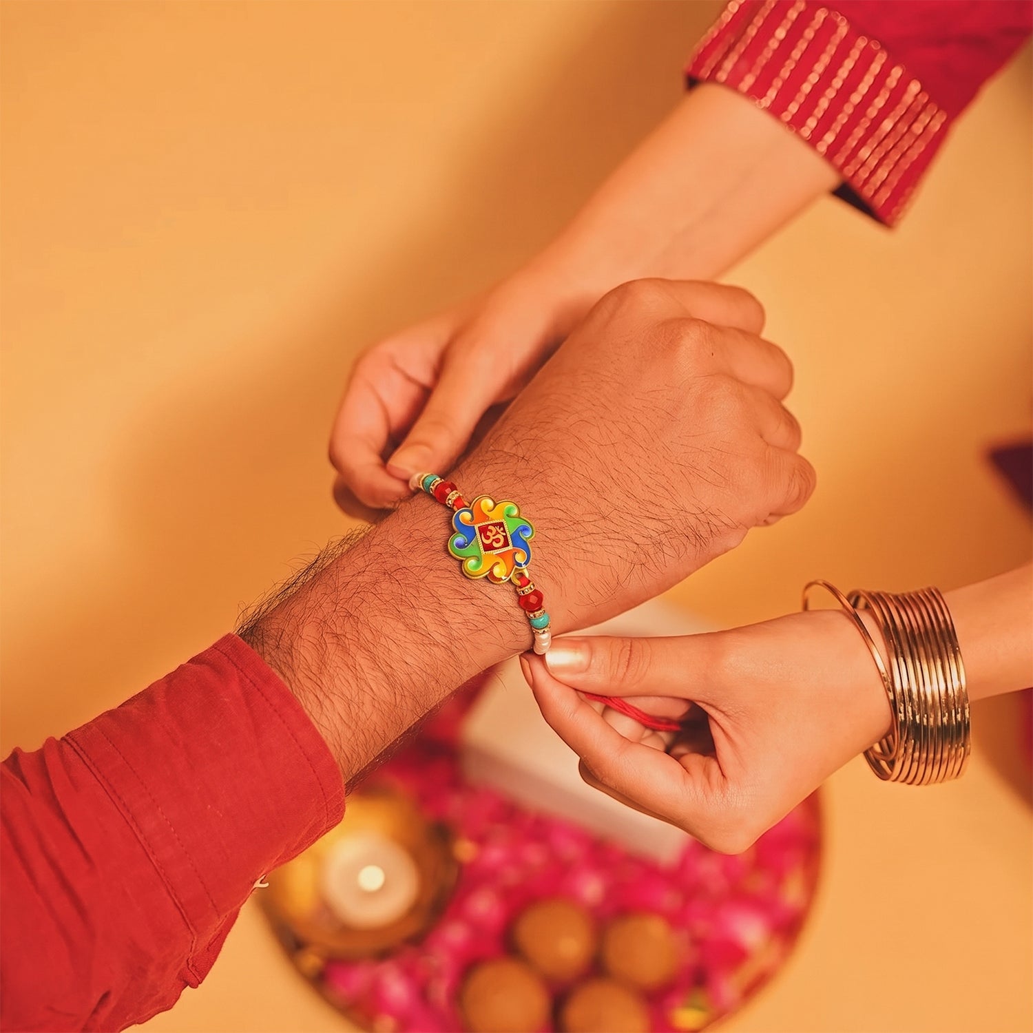 Stylish focal centerpiece of Om Symbol Rakhi with beads