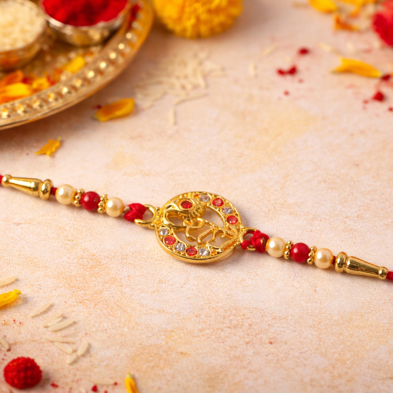 Close-up of Radhe name rakhi with colorful beads