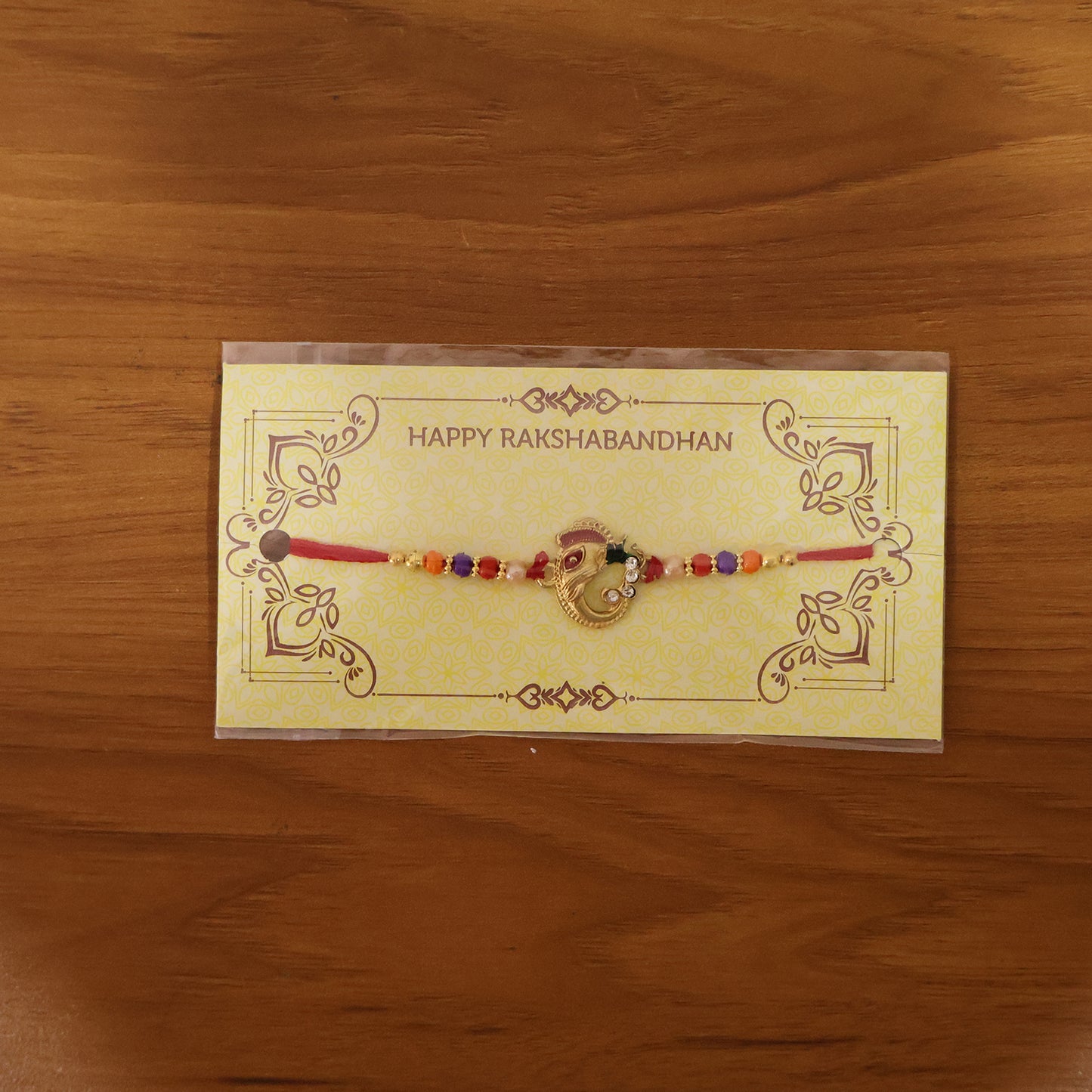 Festive designer rakhi displayed on hand