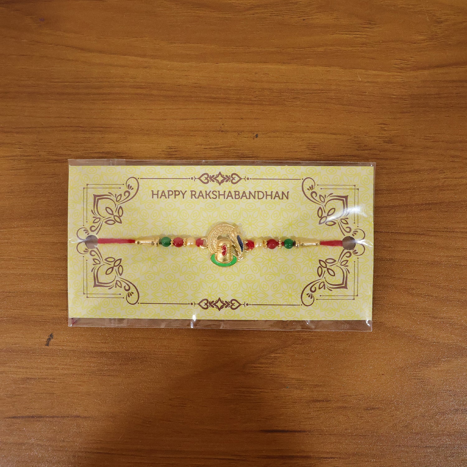 Traditional Designer Ganesha Rakhi in natural setting