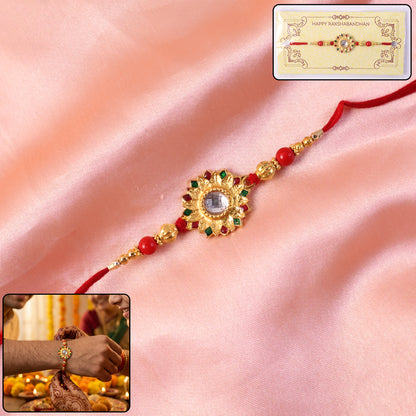 Close-up of Veera Ki traditional Rakhi with pearl and bead accents