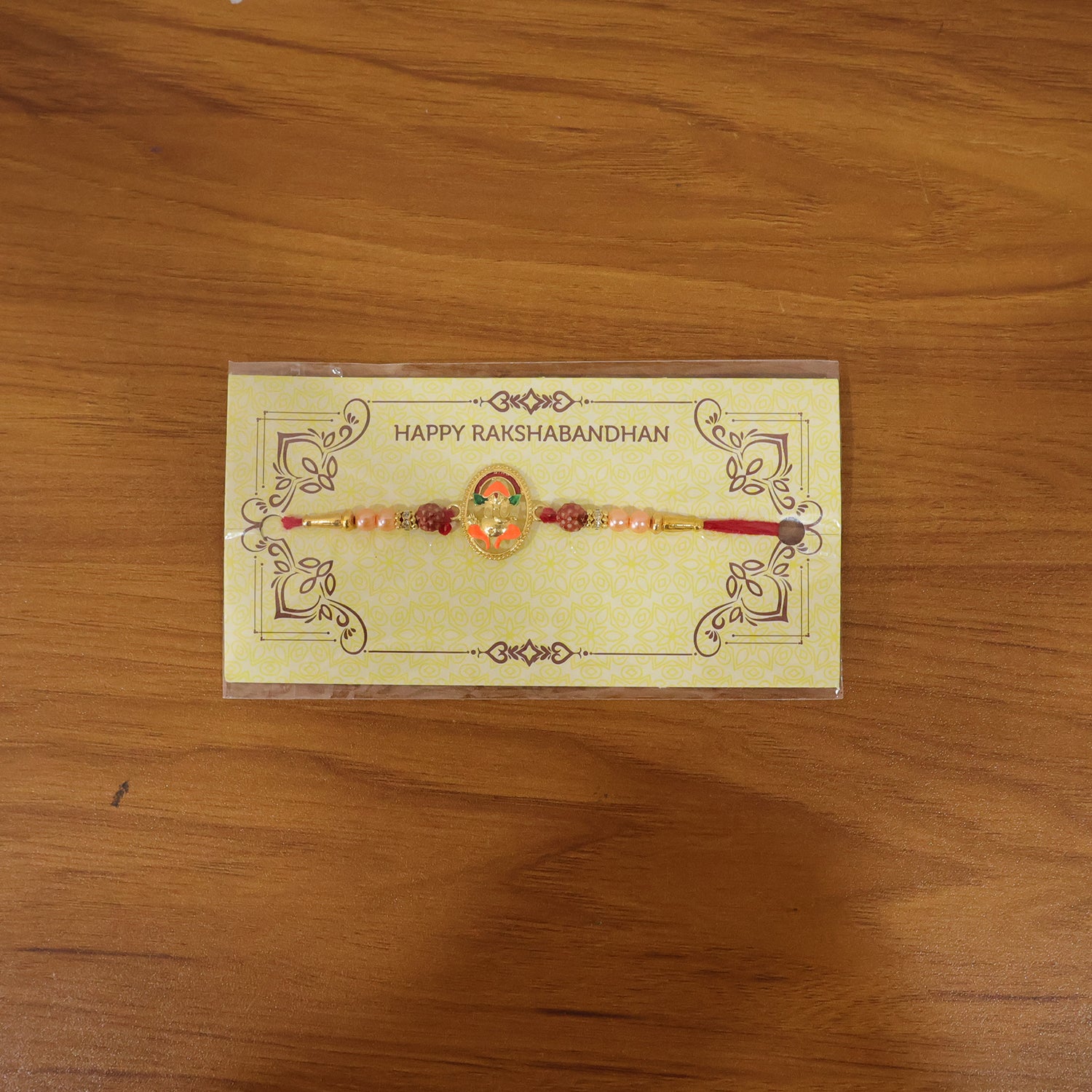 Live image of Ganesha design rakhi on hand