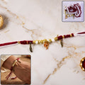 Rakhi Bracelet – Ethnic design with Ganesh charm and feather accents