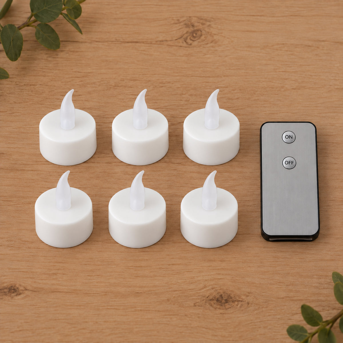 Six white LED flameless candles with clear plastic flames and a gray remote control on a light wooden surface.