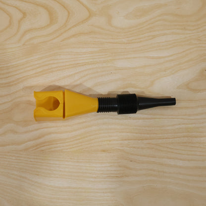 Hand holding the flexible plastic funnel ready for use.
