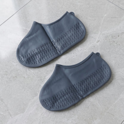 Shoe covers worn outdoors on wet pavement