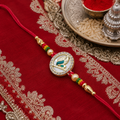 Golden Mor Pankh Rakhi with American Diamond Studded Mother of Pearl Base & Beads Set
