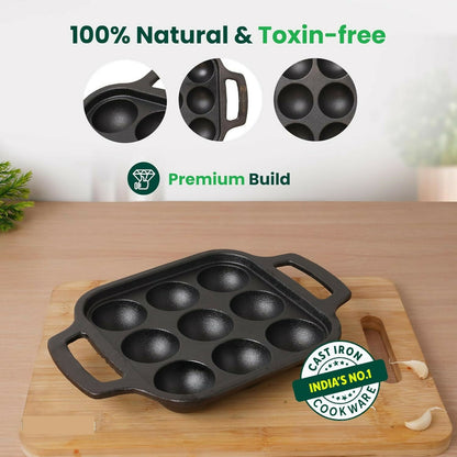 Side view of cast iron paniyaram pan with handles