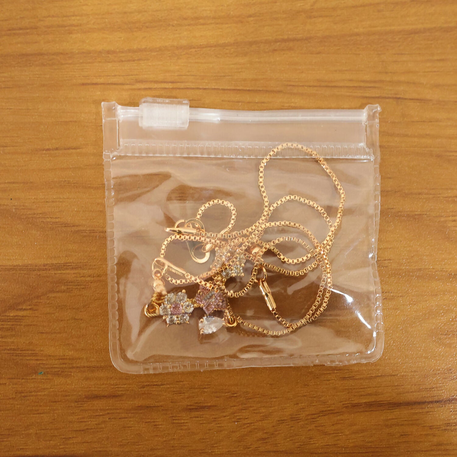 Styled image of gold finish floral stone necklace worn to highlight neckline