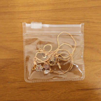 Styled image of gold finish floral stone necklace worn to highlight neckline