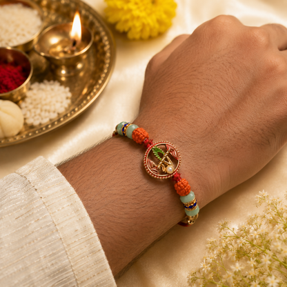 A man's arm wearing a red string bracelet with a central gold oval charm, orange and green beads, and blue accents, next to