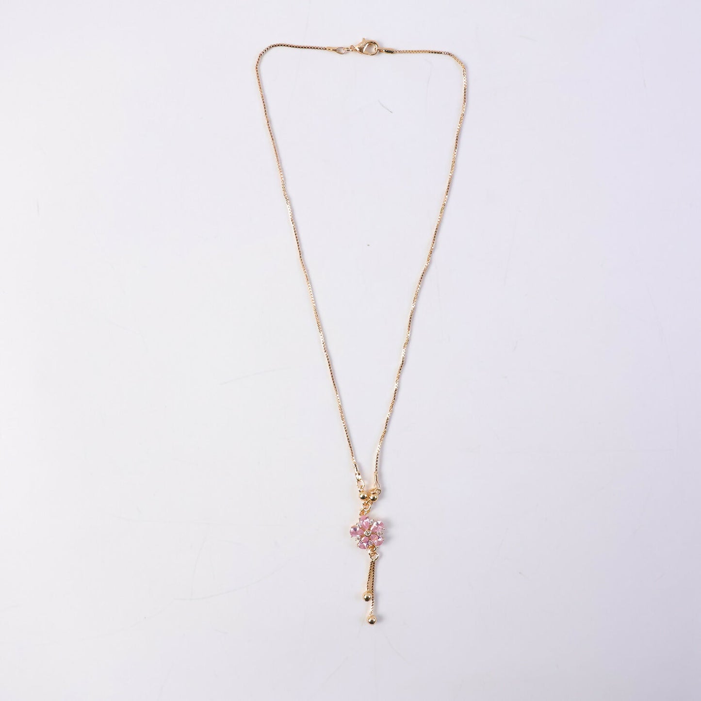 Pink floral crystal pendant necklace styled with festive and western outfits