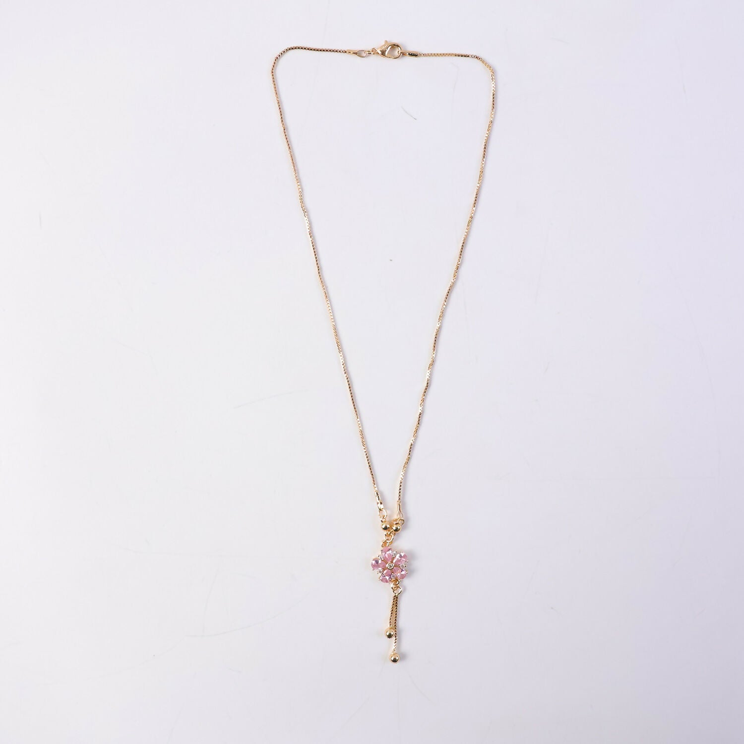 Pink floral crystal pendant necklace styled with festive and western outfits