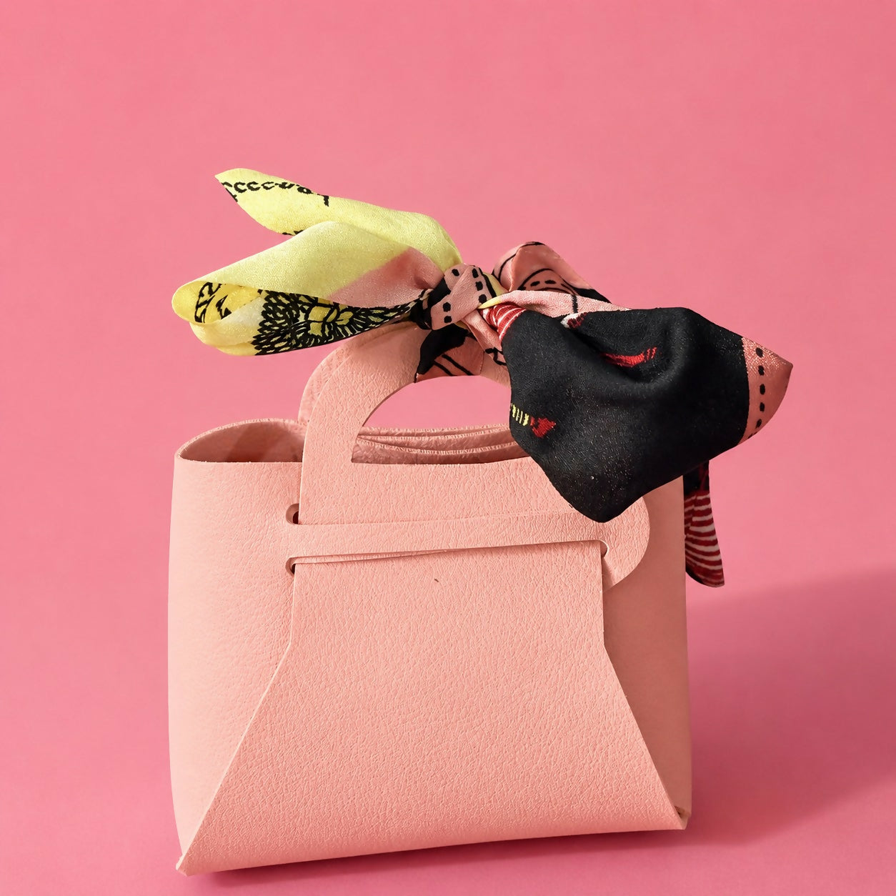 Stylish mini handbag in pink with textured finish
