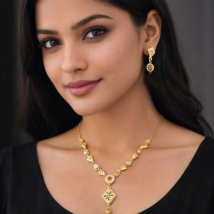 Close-up of intricate design and sparkling stones on gold-plated necklace set
