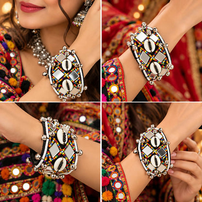 Four different views of a woman's arm wearing a black cuff bracelet with colorful beads, mirrors, and shells.