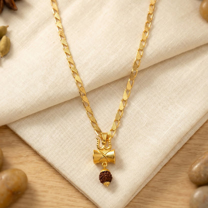 Close-up of the gold finish Rudraksha Damru Trishul necklace