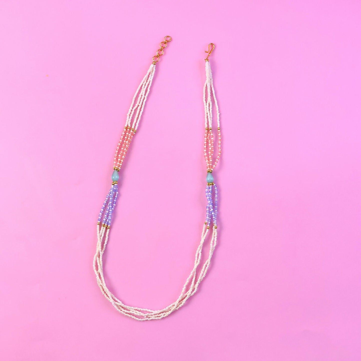 Pastel pearl beaded necklace highlighting peach and lavender tones