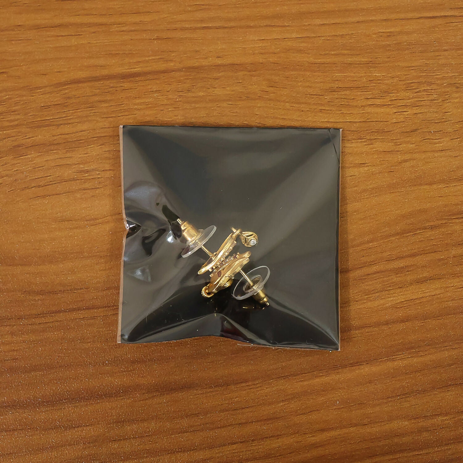 Traditional Curved Leaf Style Gold Stud Earrings With Crystal Detailing And Drop Charm