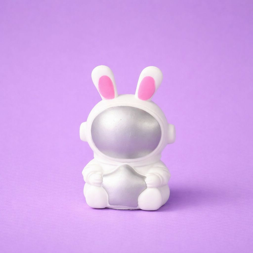 Bunny astronaut night lamp glowing on kids desk