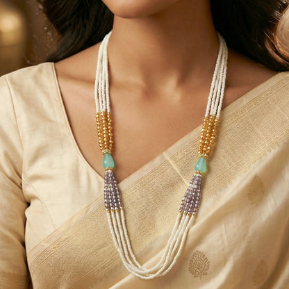 Elegant layered pearl necklace displayed on white background
