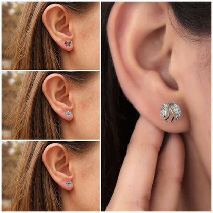 Silver flower-shaped stud earrings adorned with clear Cubic Zirconia stones