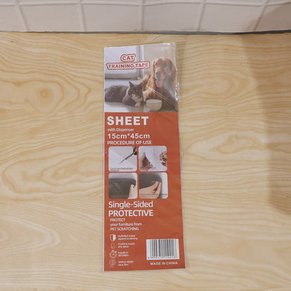 Pet owner applying transparent scratch prevention tape on furniture